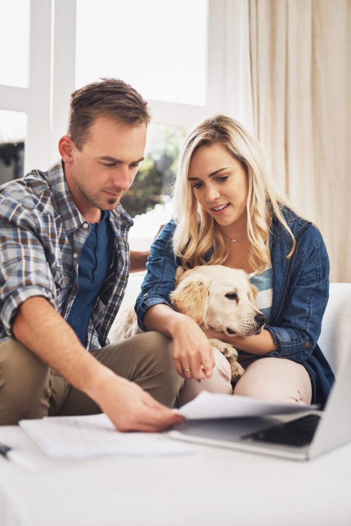 Working through all their finances. Shot of a young couple doing their finances together at home.